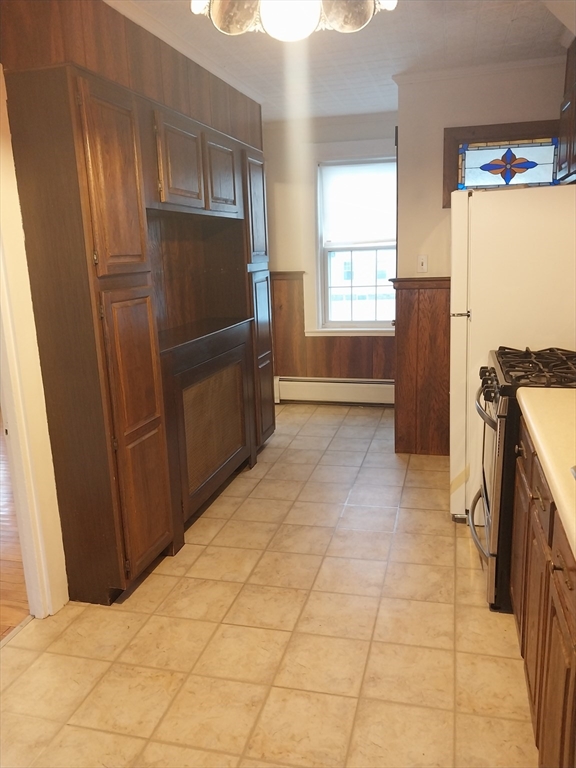 49 Salem Street, Unit 1 Haverhill, MA 01835 - Photo 4 of 16 a kitchen with stainless steel appliances a refrigerator and microwave