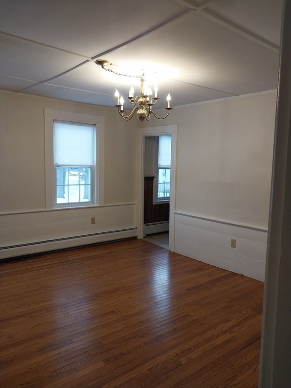 49 Salem Street, Unit 1 Haverhill, MA 01835 - Photo 8 of 16 wooden floor in an empty room with a window