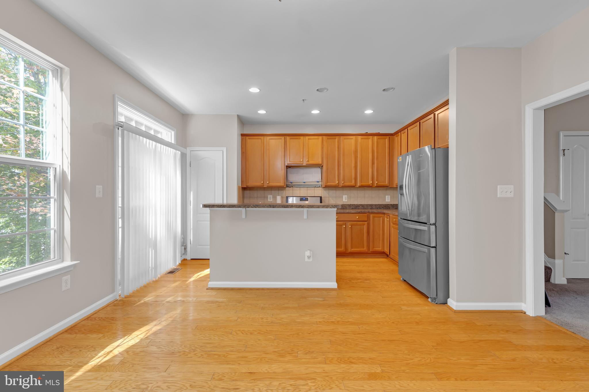 626 Tailgate Terrace Landover, MD 20785 - Photo 11 of 36 a kitchen with stainless steel appliances granite countertop a refrigerator a sink dishwasher and a oven with large countertops