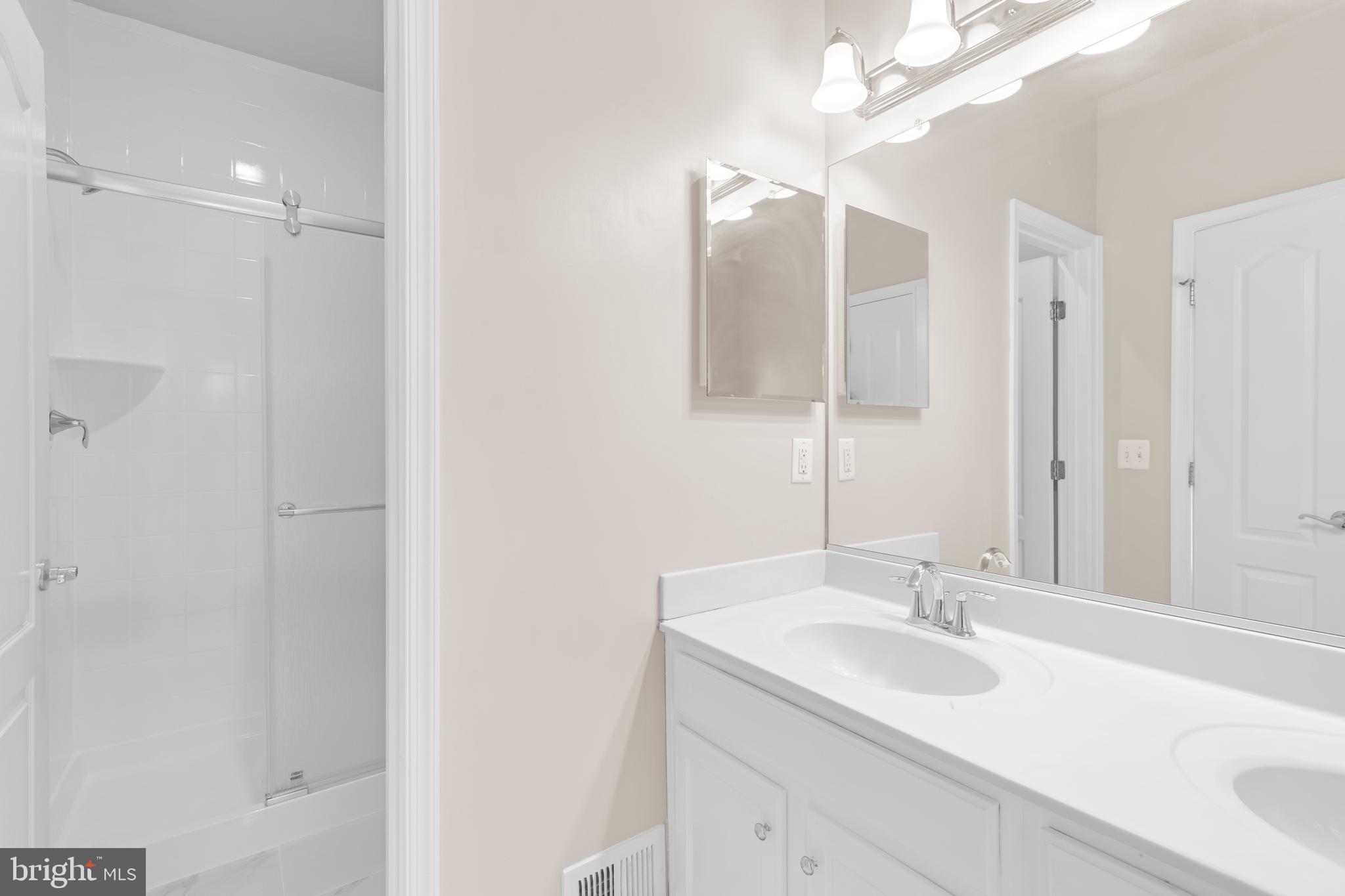 626 Tailgate Terrace Landover, MD 20785 - Photo 22 of 36 a bathroom with a sink and a mirror