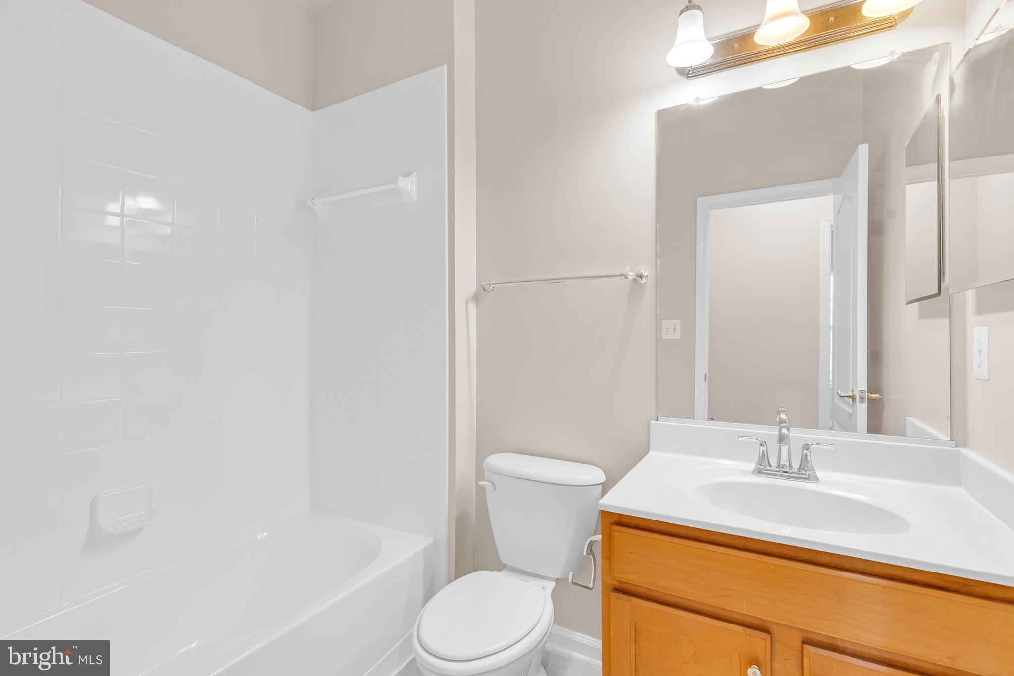 626 Tailgate Terrace Landover, MD 20785 - Photo 28 of 36 a bathroom with a sink toilet vanity and tub