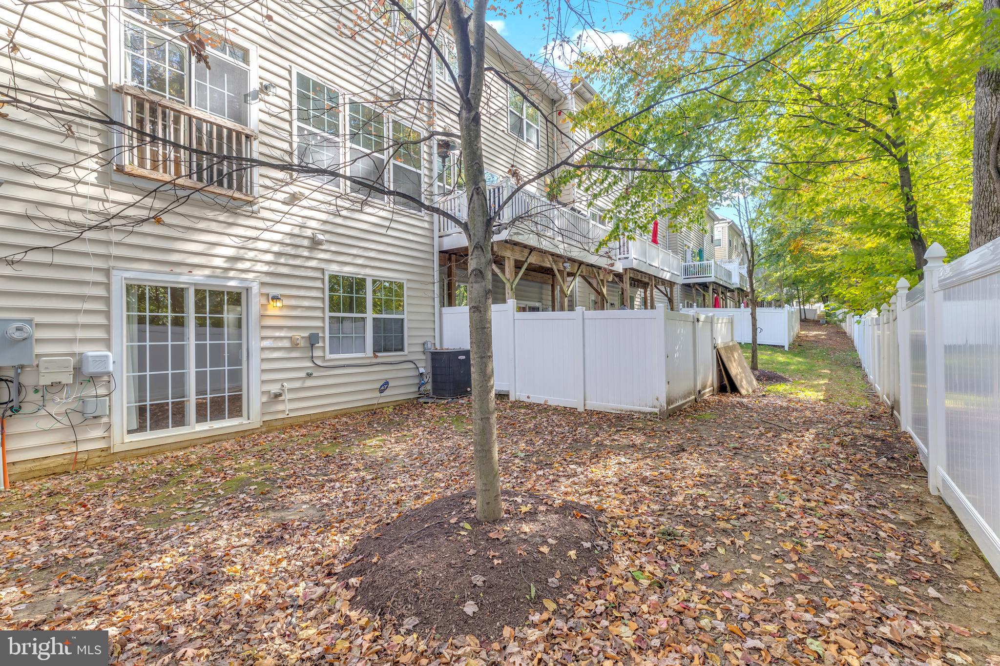 626 Tailgate Terrace Landover, MD 20785 - Photo 35 of 36 a view of a house with a yard and garage