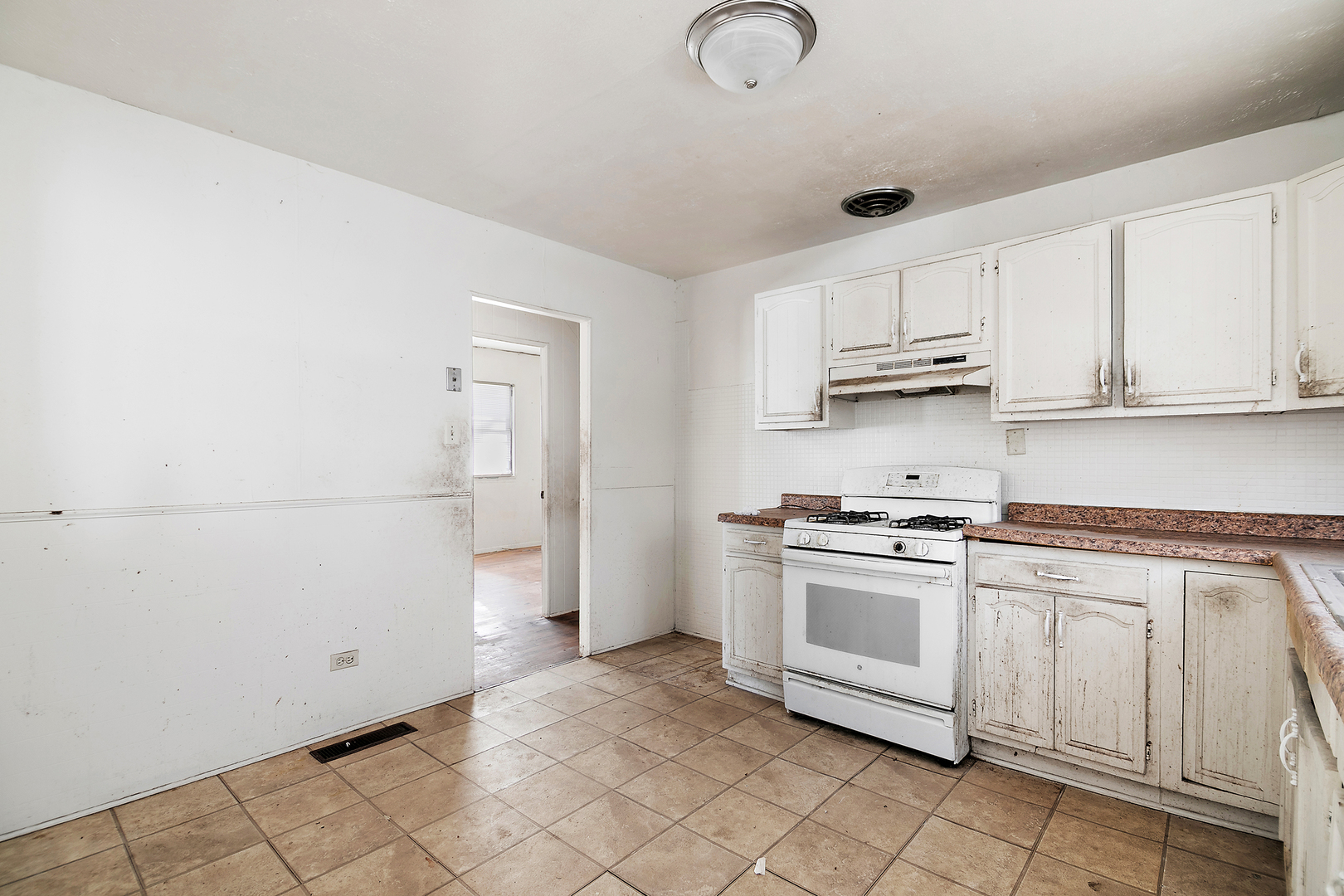1869 Summit Avenue Kankakee, IL 60901 - Photo 7 of 13 a kitchen with stainless steel appliances granite countertop a sink a stove and a refrigerator