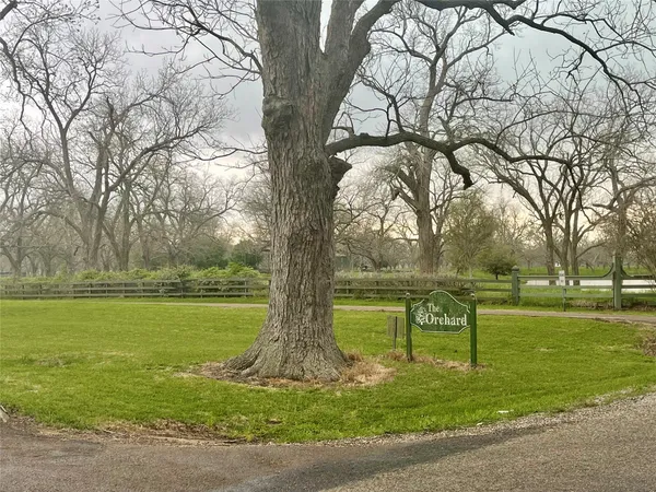 a view of a golf course with a lake