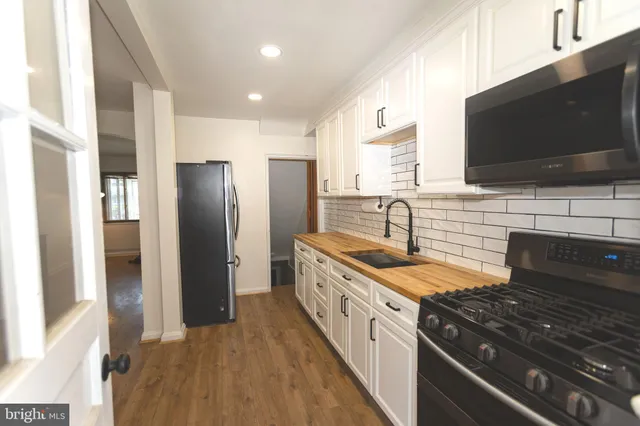 a bedroom with a bed and a potted plant