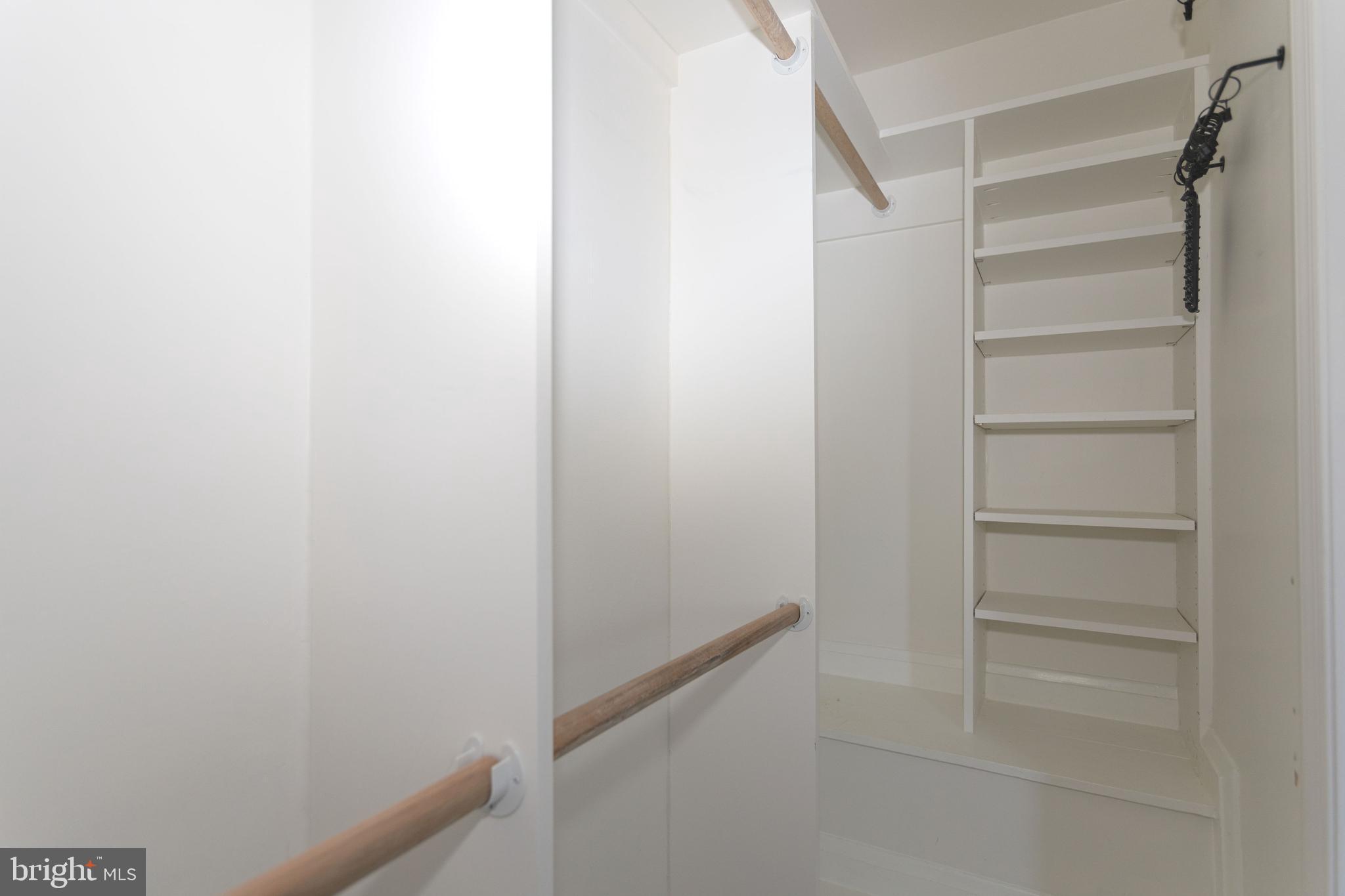 1940 Wareham Road Baltimore, MD 21222 - Photo 15 of 37 a view of walk in closet with empty racks