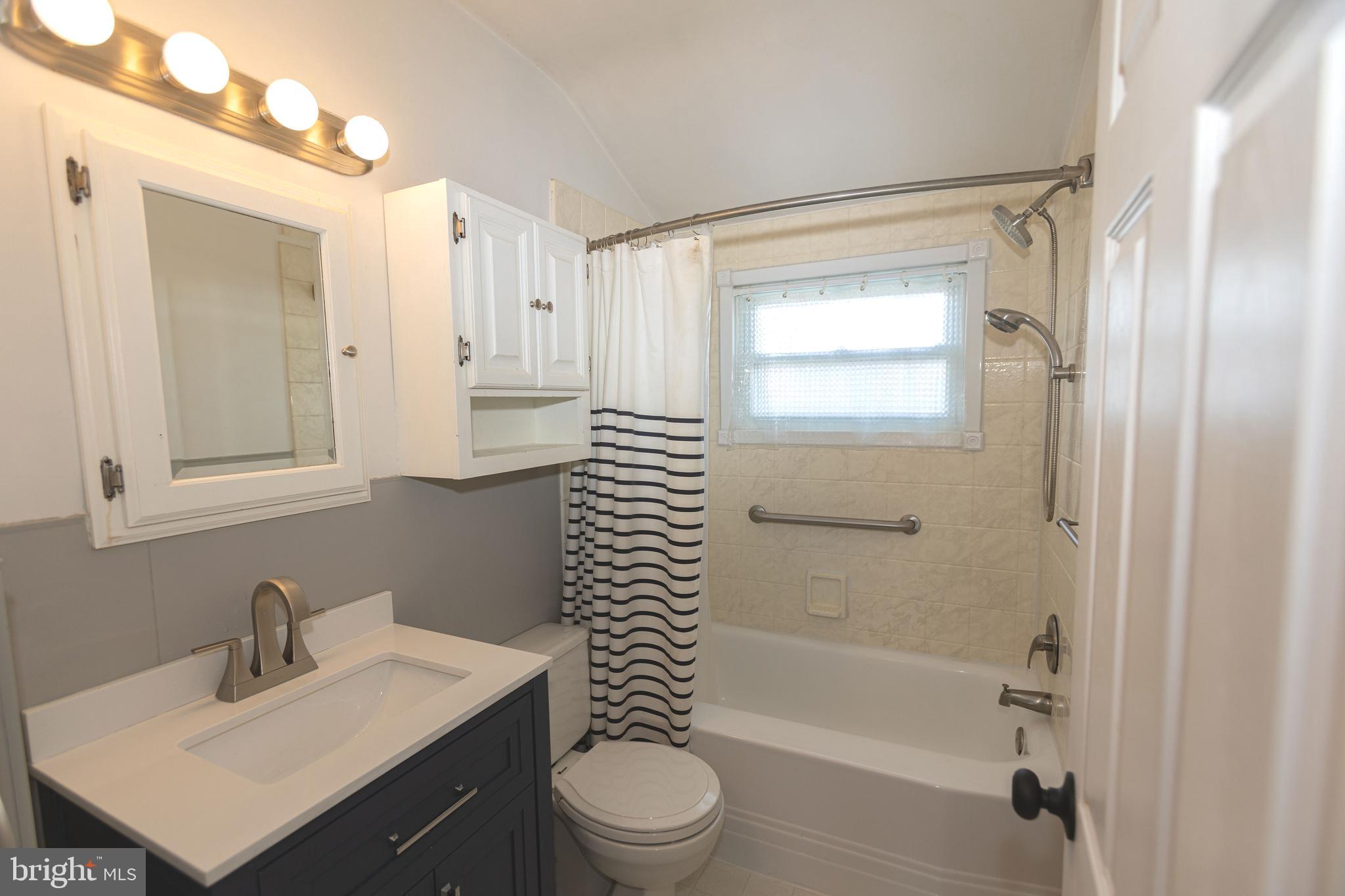 1940 Wareham Road Baltimore, MD 21222 - Photo 16 of 37 a bathroom with a sink a toilet and shower