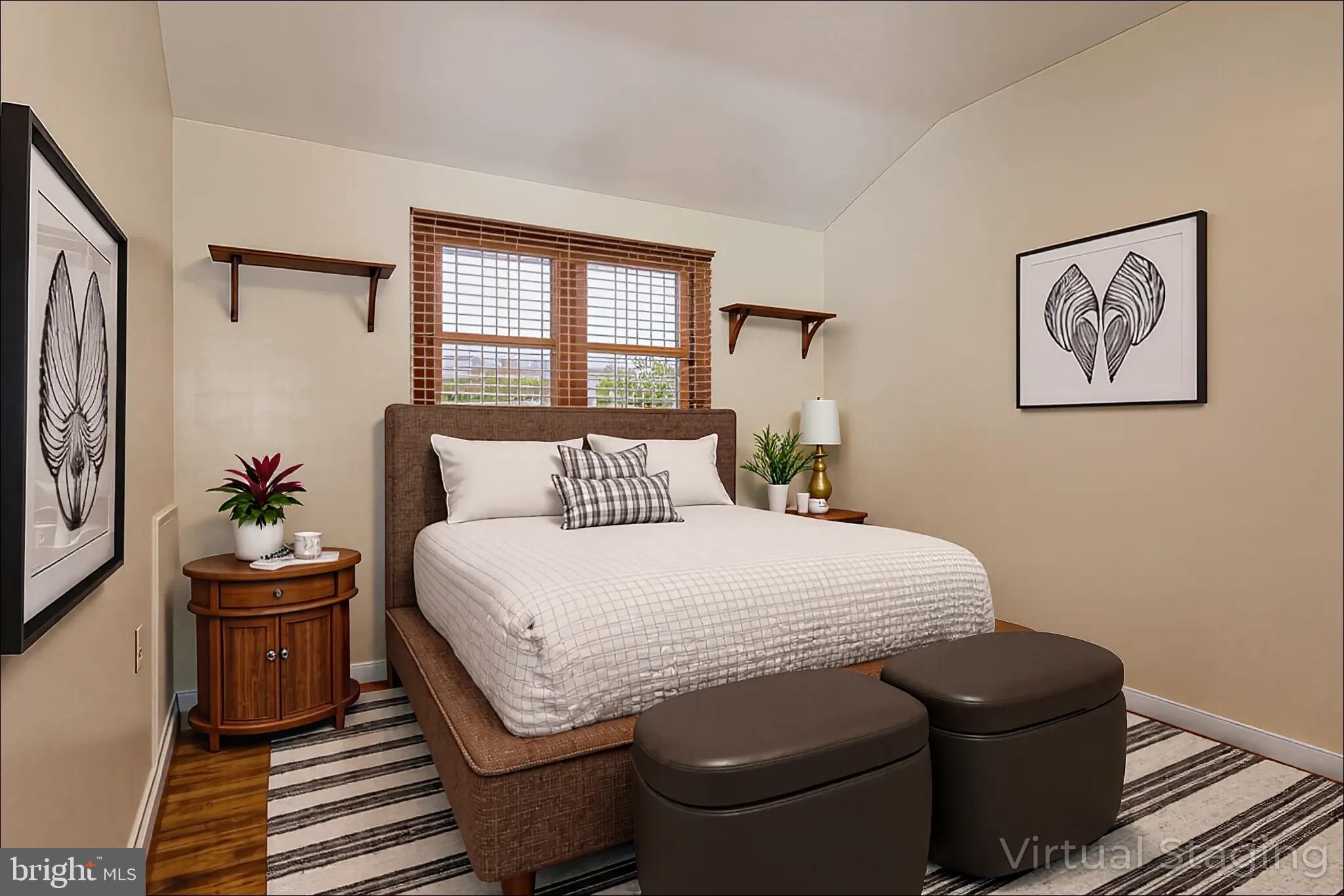 1940 Wareham Road Baltimore, MD 21222 - Photo 17 of 37 a bedroom with a bed and wooden floor