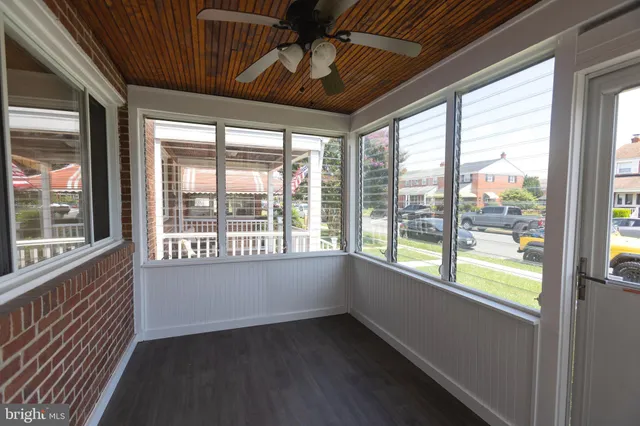 a view of backyard with a deck