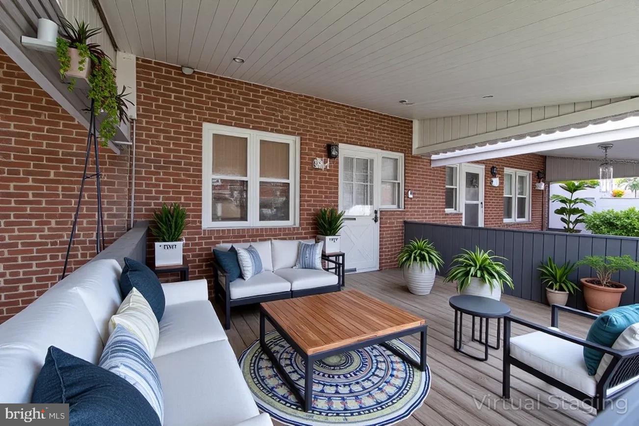 1940 Wareham Road Baltimore, MD 21222 - Photo 3 of 37 a outdoor living room with furniture and a potted plant