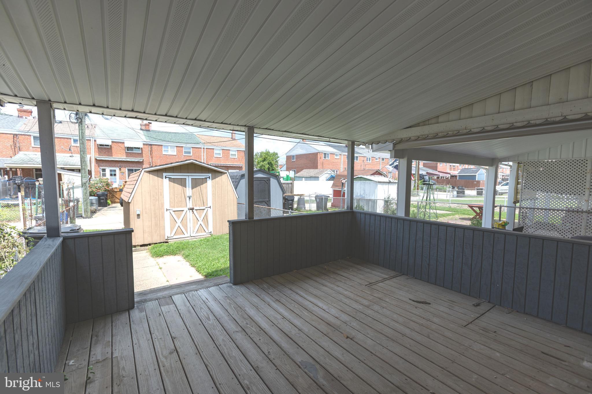 1940 Wareham Road Baltimore, MD 21222 - Photo 32 of 37 an empty room with wooden floor and large windows