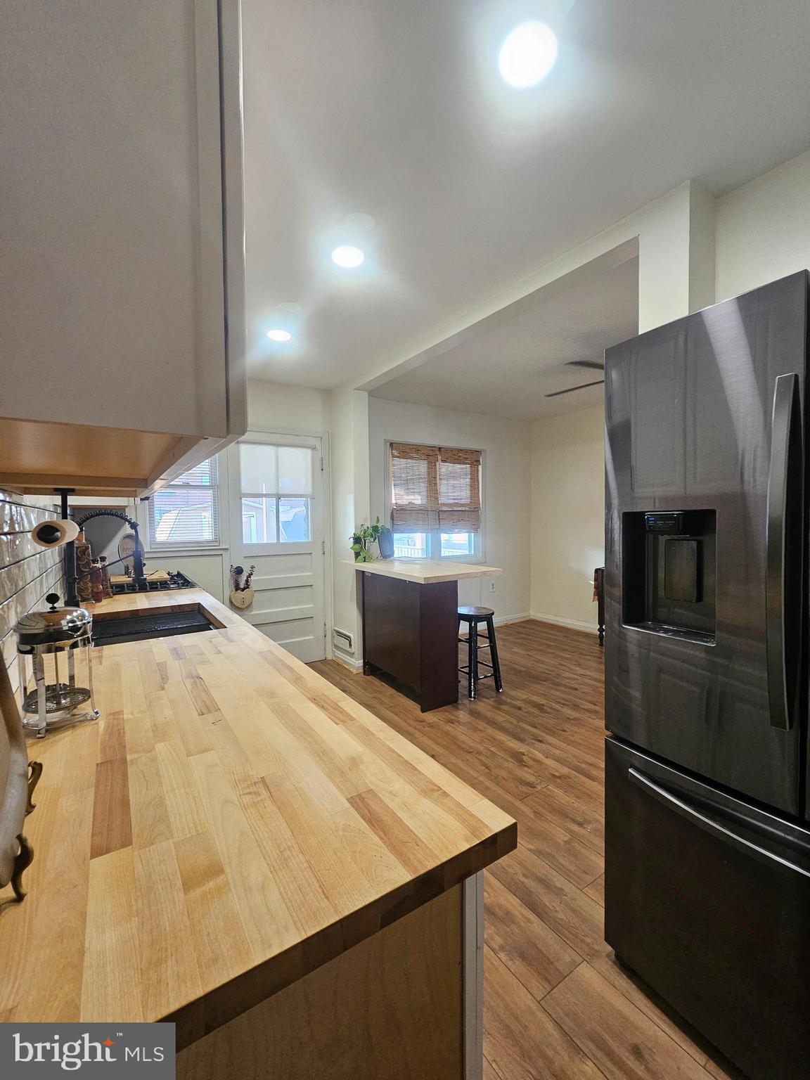 1940 Wareham Road Baltimore, MD 21222 - Photo 8 of 37 a kitchen with stainless steel appliances wooden floor and a refrigerator