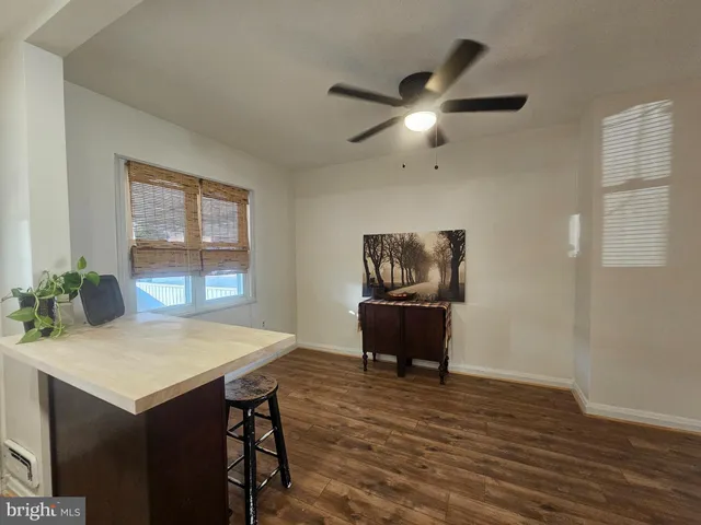 a spacious bathroom with a bathtub and shower