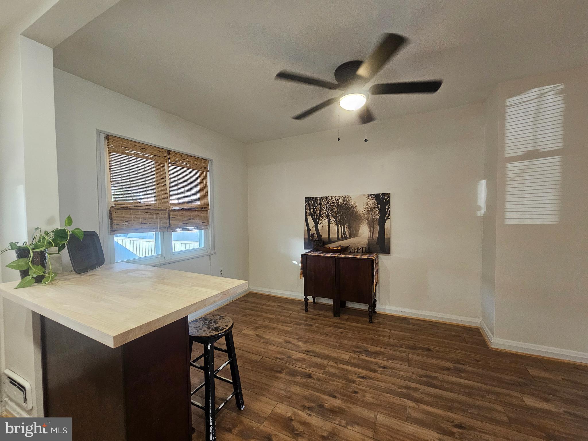 1940 Wareham Road Baltimore, MD 21222 - Photo 9 of 37 a view of a dining room with furniture window and wooden floor