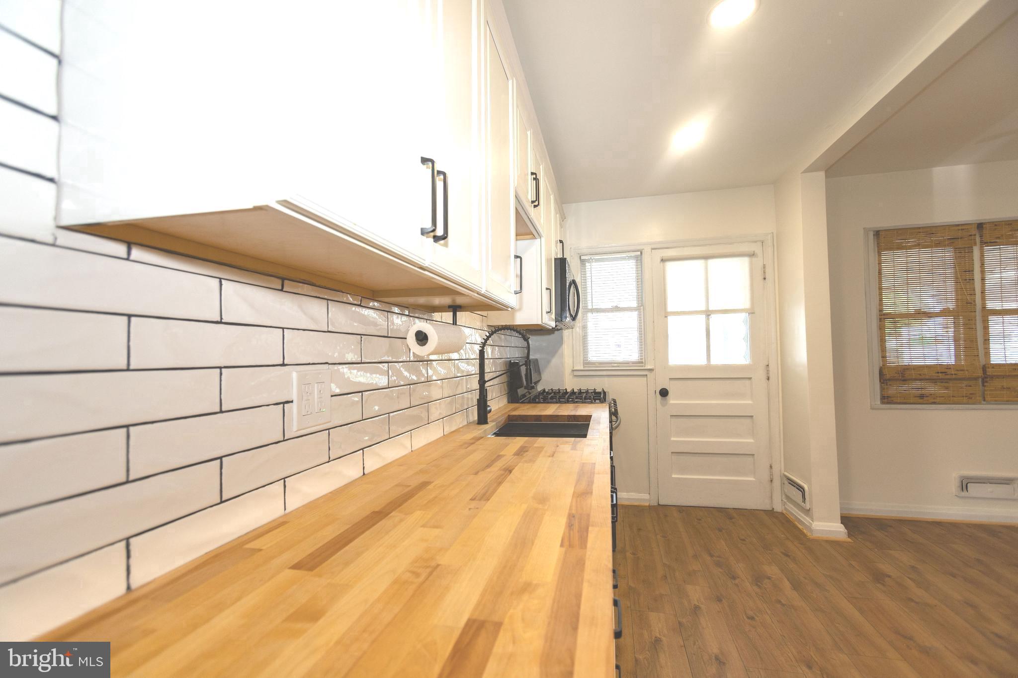 1940 Wareham Road Baltimore, MD 21222 - Photo 10 of 37 a spacious bathroom with a bathtub and shower