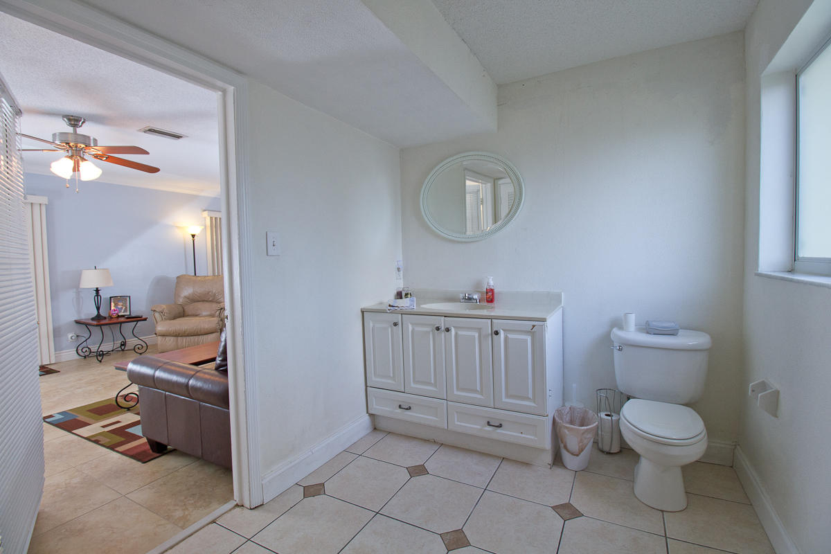 1026 West Camino Real Boca Raton, FL 33486 - Photo 7 of 32 07 Half Bathroom off of Living Room