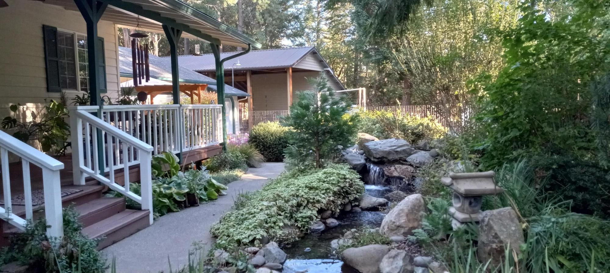10596 West Evans Creek Road Rogue River, OR 97537 - Photo 2 of 35 entrance and waterfall