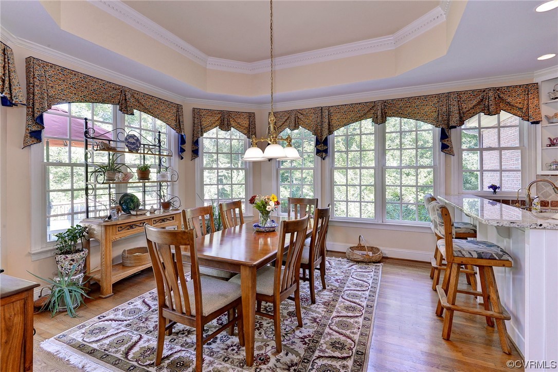 207 Shady Bluff Point Williamsburg, VA 23188 - Photo 12 of 49 a view of a dining room with furniture window and wooden floor