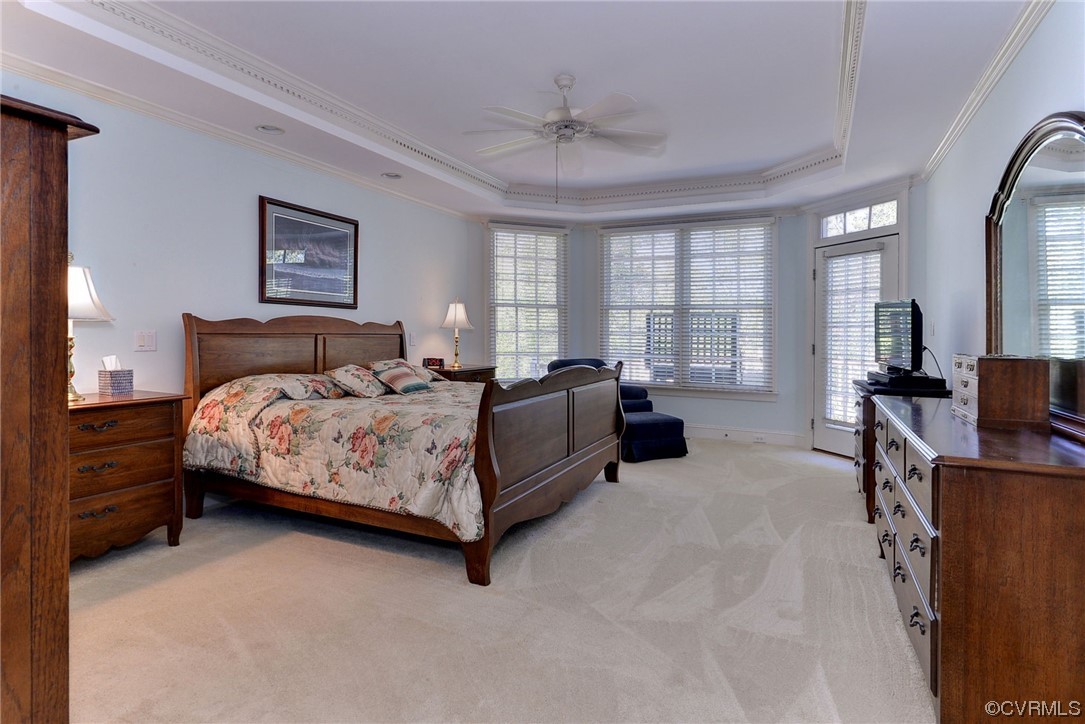 207 Shady Bluff Point Williamsburg, VA 23188 - Photo 16 of 49 a bedroom with a bed couch and a large window