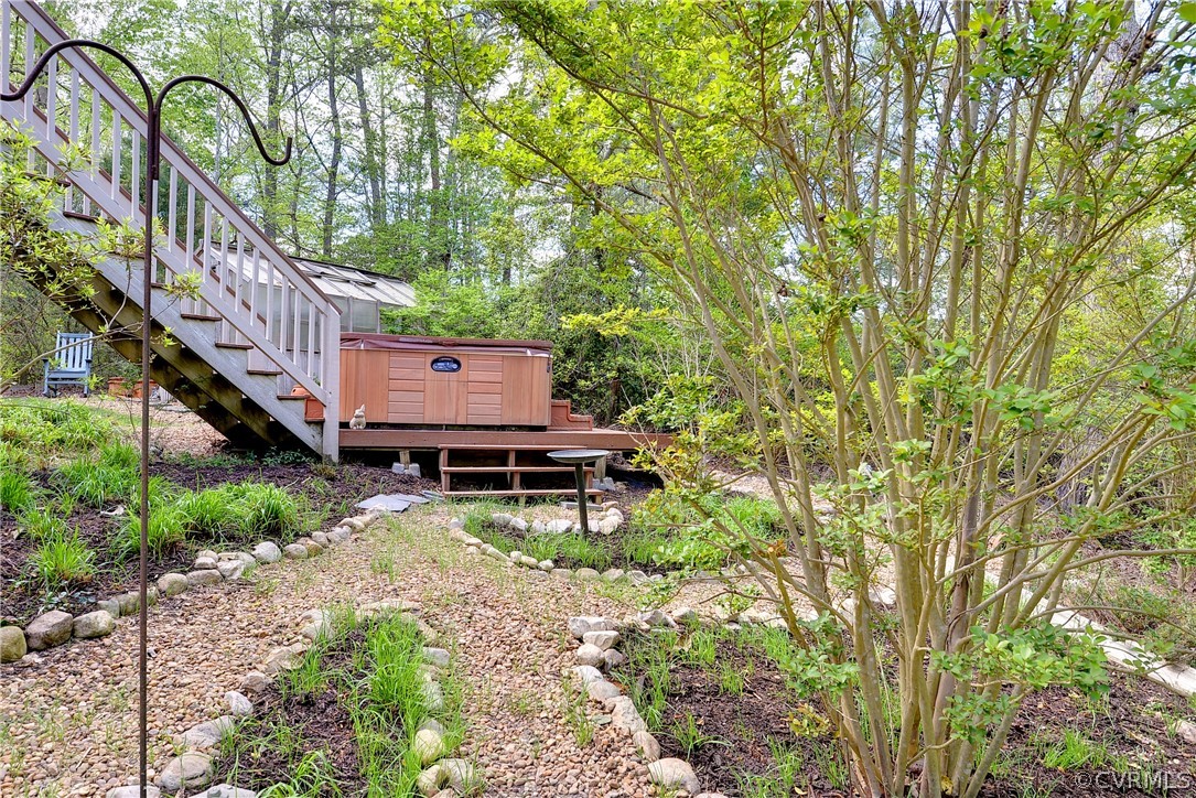 207 Shady Bluff Point Williamsburg, VA 23188 - Photo 32 of 49 a wooden bench sitting in the middle of a forest