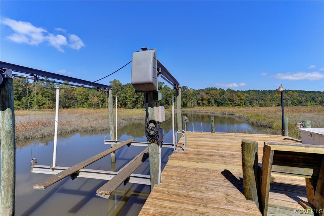 207 Shady Bluff Point Williamsburg, VA 23188 - Photo 40 of 49 a roof deck with a table and chairs