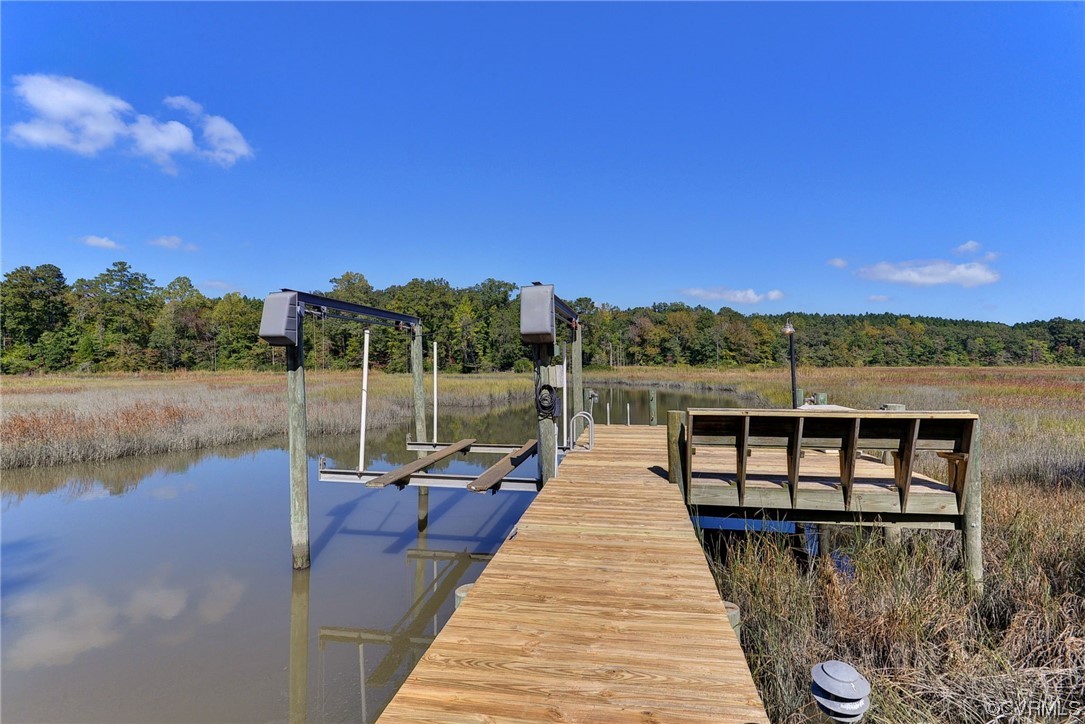 207 Shady Bluff Point Williamsburg, VA 23188 - Photo 46 of 49 a view of swimming pool with lake and mountain in the back