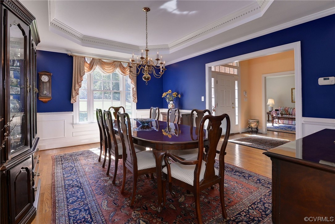 207 Shady Bluff Point Williamsburg, VA 23188 - Photo 8 of 49 a view of a dining room with furniture window and wooden floor