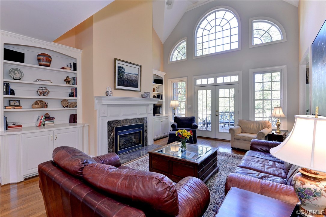 207 Shady Bluff Point Williamsburg, VA 23188 - Photo 10 of 49 a living room with furniture fireplace and a large window