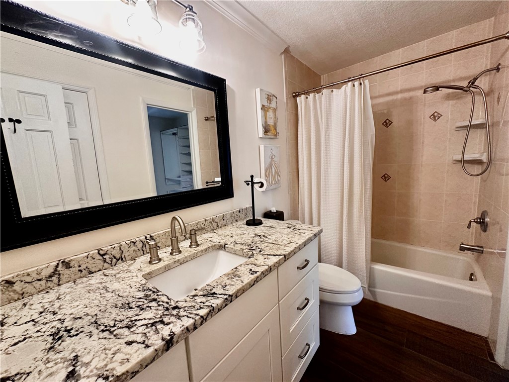 1815 Robalo Drive, Unit C201 Vero Beach, FL 32960 - Photo 13 of 31 a bathroom with a granite countertop sink and a mirror