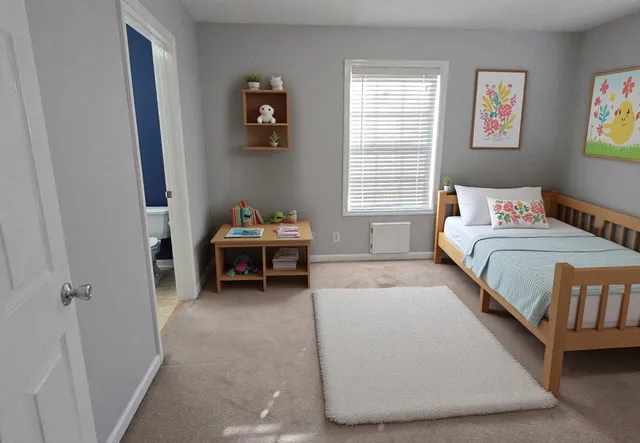 a bedroom with bed and a window