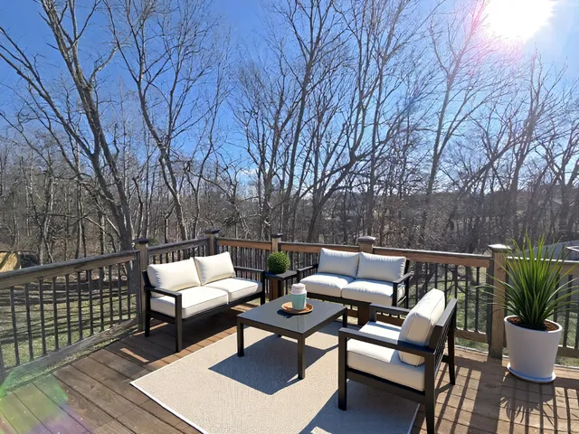 a patio with patio a couch and chairs