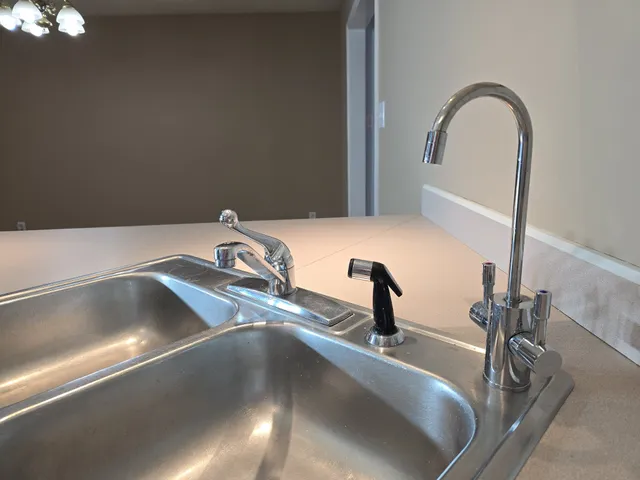 a close view of a sink and a faucet in a kitchen