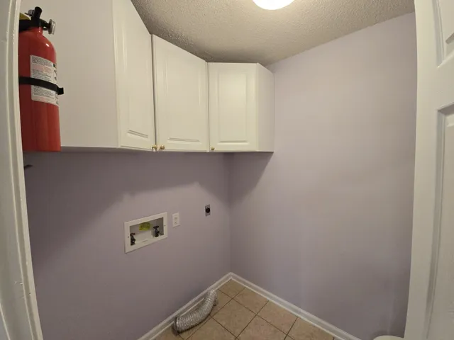 a view of storage and utility room with washer and dryer