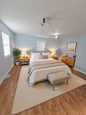a bedroom with bed and window