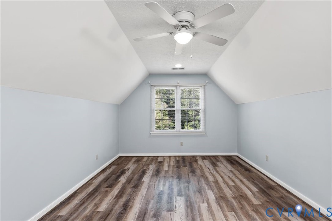 1437 Palmore Road Powhatan, VA 23139 - Photo 35 of 60 Spacious room featuring wood-finish flooring, a ce