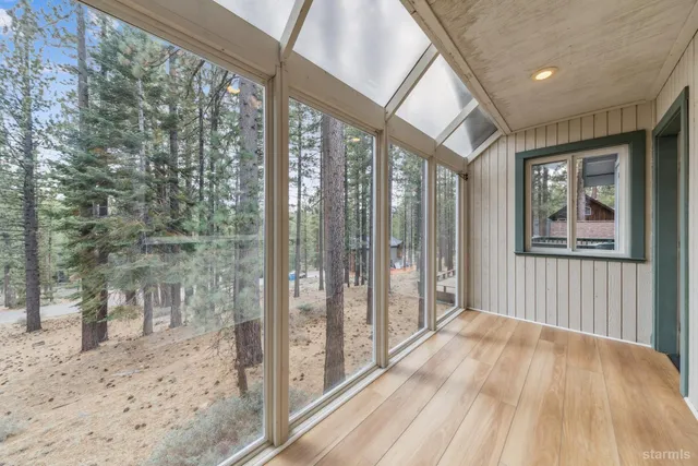 a view of a room with a large window