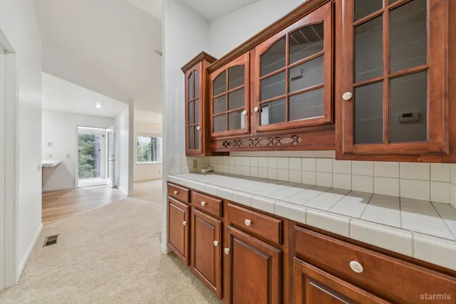 a view of a kitchen with a sink and cabinets