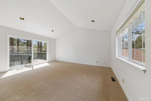 a view of an empty room with a large window