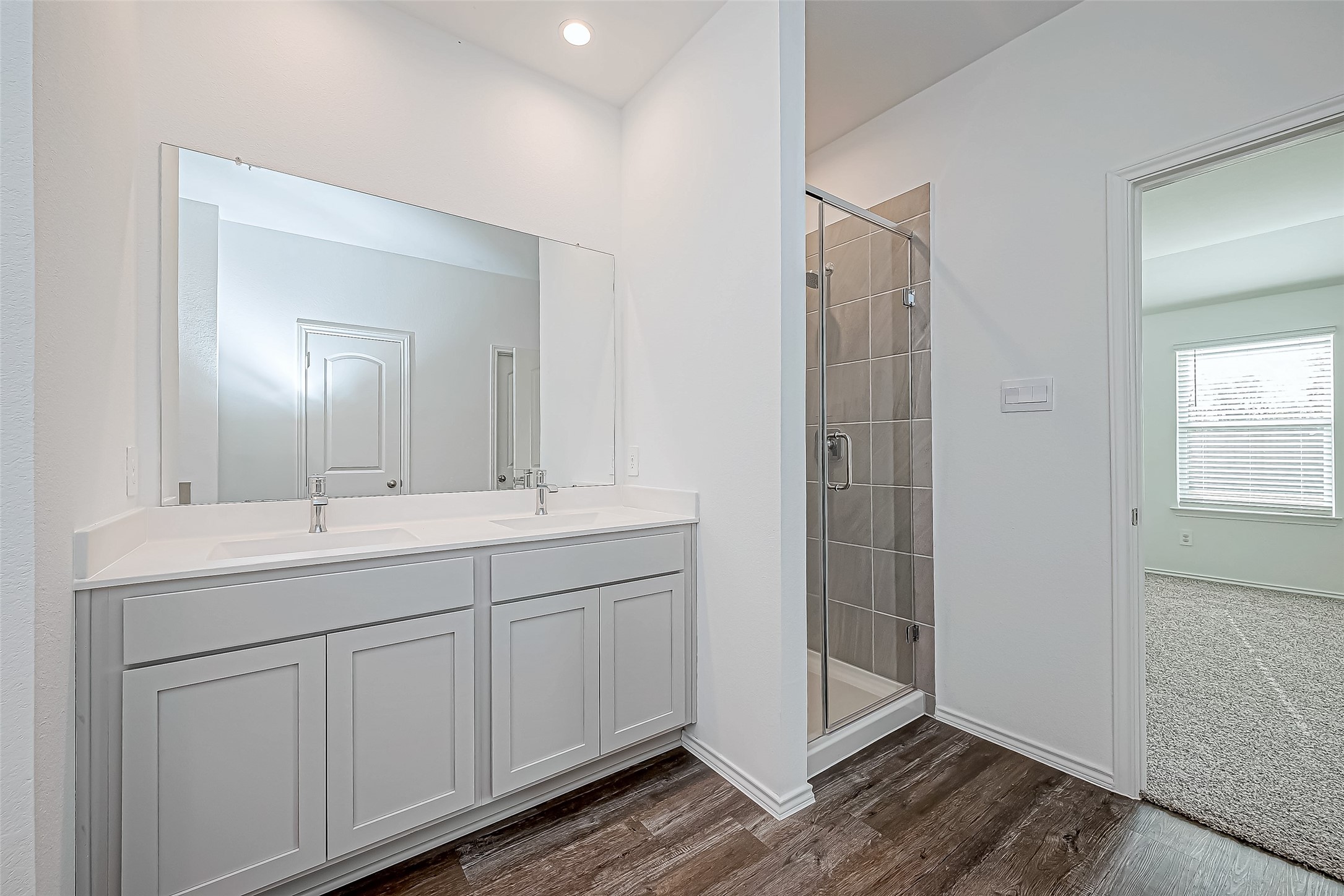 532 Comal Trail Dayton, TX 77535 - Photo 19 of 26 a bathroom with a double vanity sink and mirror
