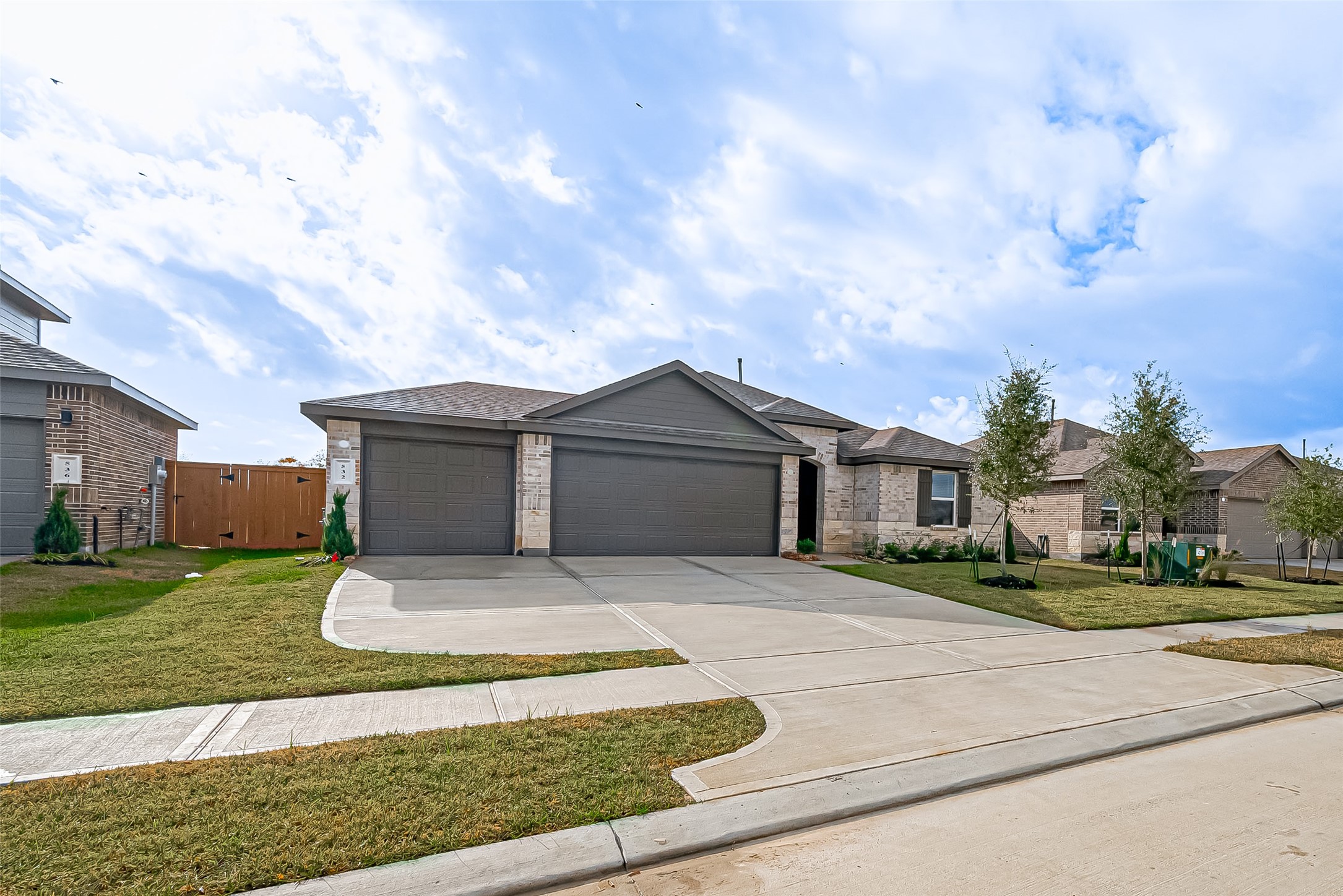 532 Comal Trail Dayton, TX 77535 - Photo 2 of 26 a front view of a house with a yard