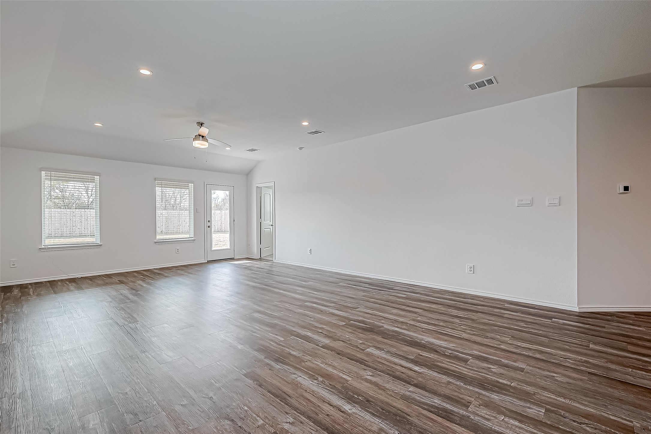 532 Comal Trail Dayton, TX 77535 - Photo 3 of 26 a view of empty room with wooden floor and fan