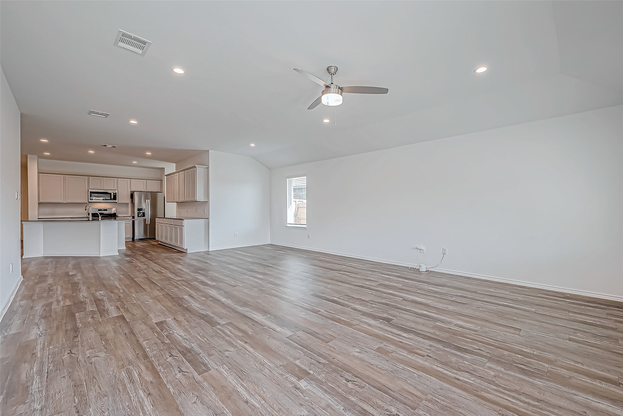 532 Comal Trail Dayton, TX 77535 - Photo 5 of 26 a view of empty room with wooden floor