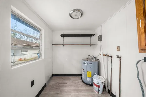 a view of an entryway with wooden floor