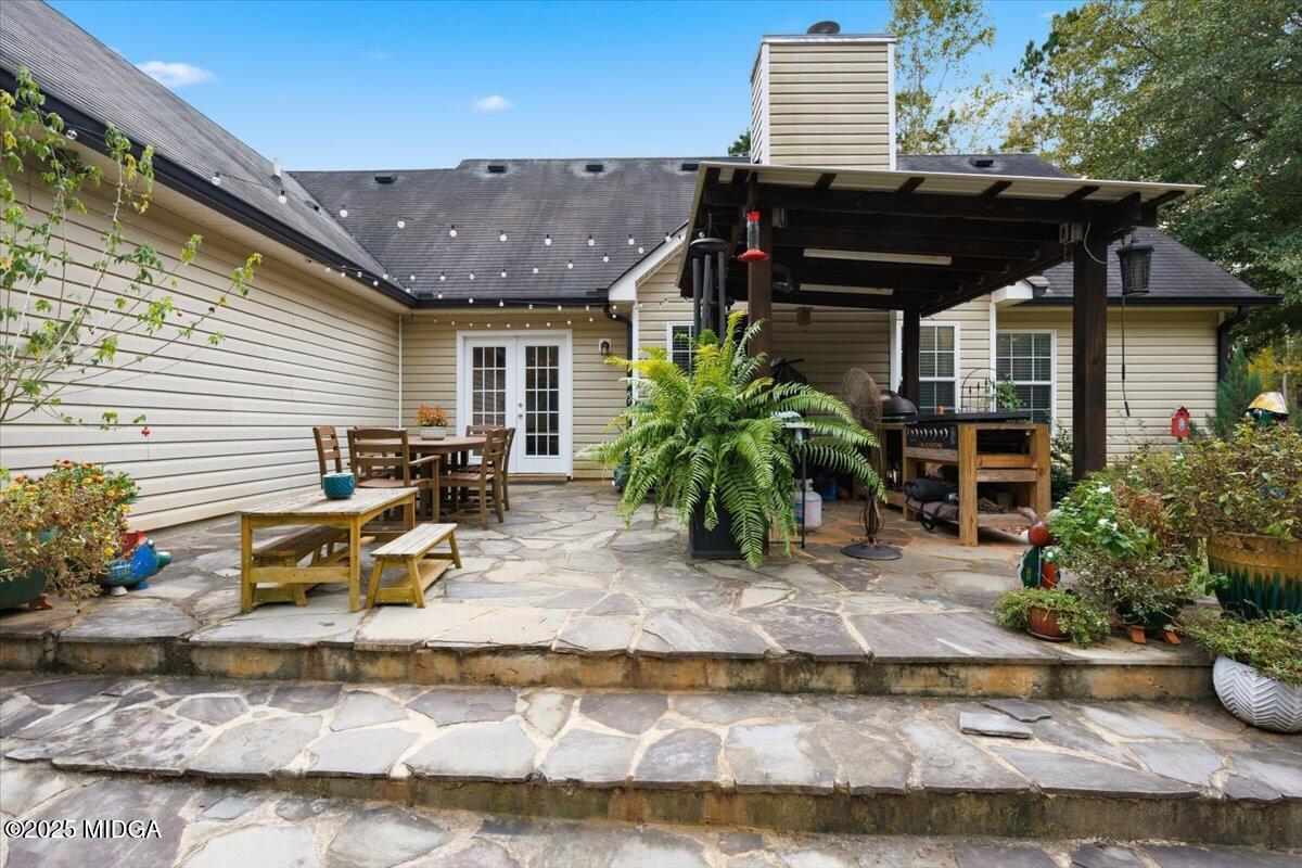 2764 Dames Ferry Road Forsyth, GA 31029 - Photo 27 of 30 a view of a house with backyard and sitting area