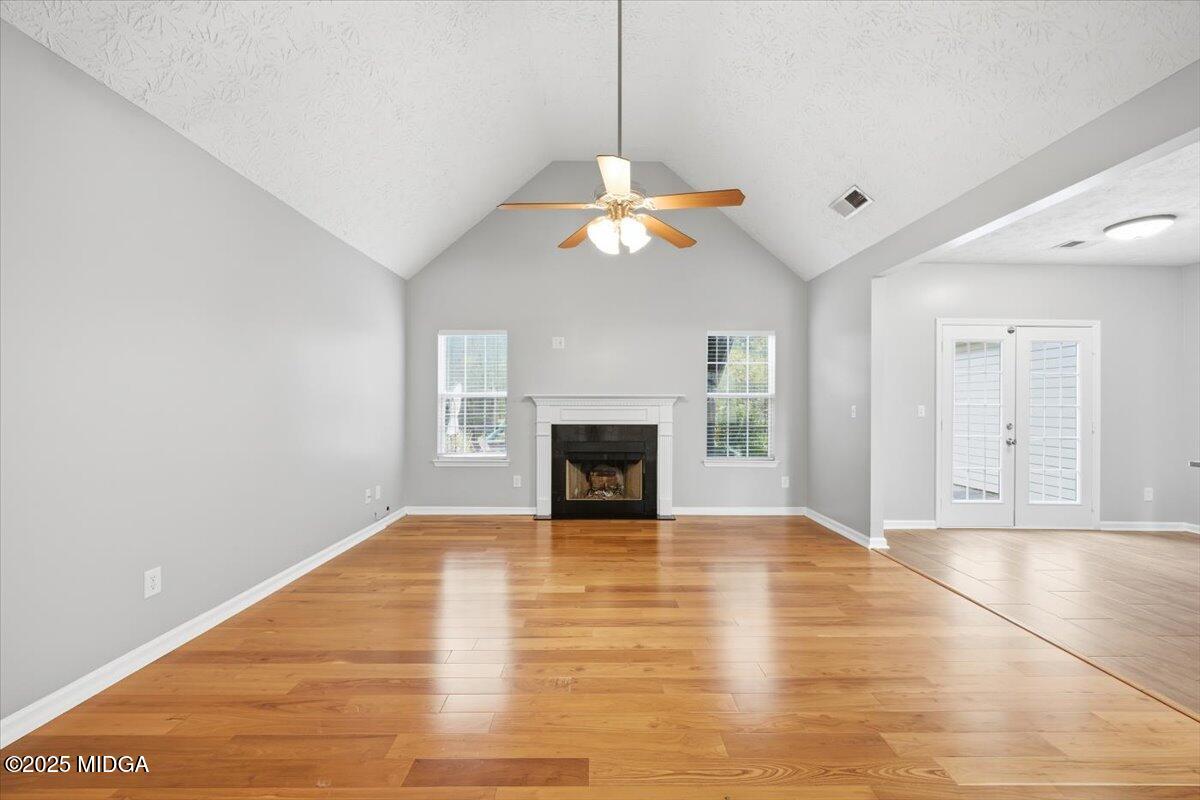 2764 Dames Ferry Road Forsyth, GA 31029 - Photo 9 of 30 a view of an empty room with a fireplace and a window