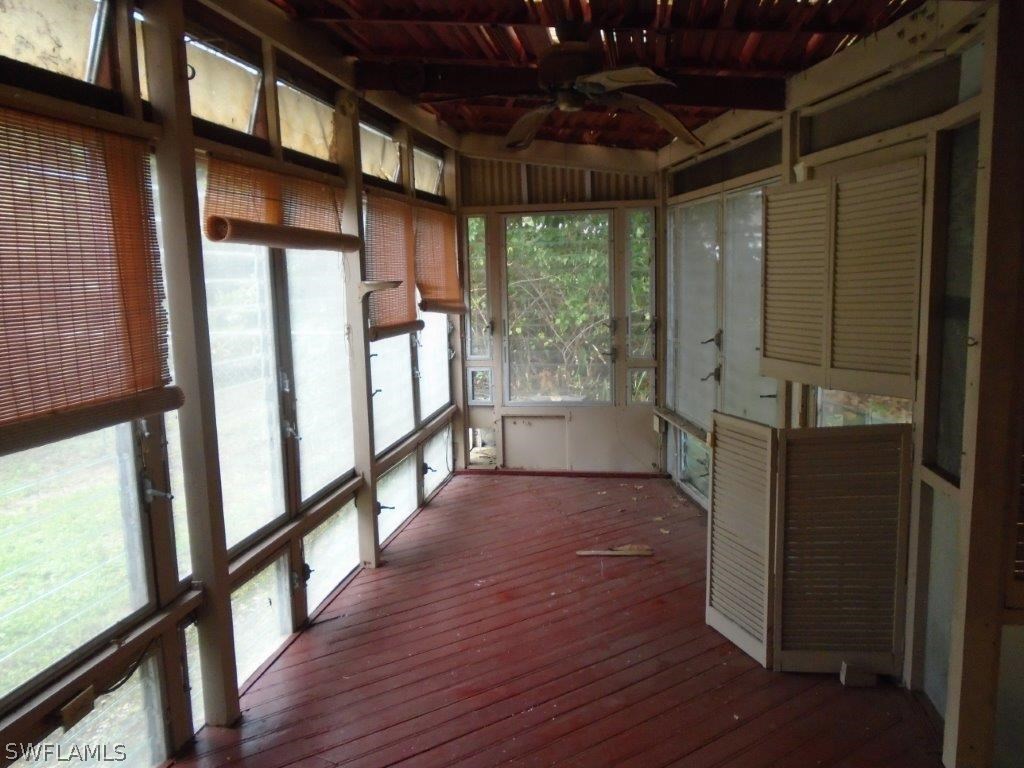 113 Rowland Road Lehigh Acres, FL 33936 - Photo 6 of 14 a view of entryway with wooden floor