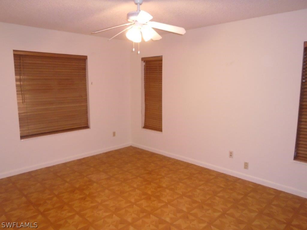 113 Rowland Road Lehigh Acres, FL 33936 - Photo 8 of 14 an empty room with a window