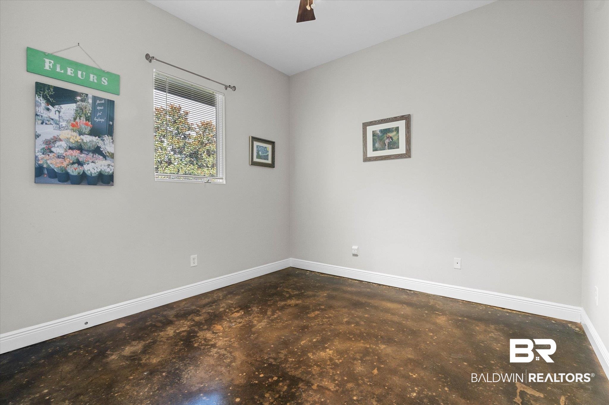 3400 Rue Royal Mobile, AL 36693 - Photo 20 of 33 Empty room with concrete floors and a ceiling fan