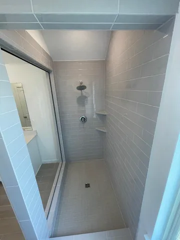 a bathroom with a shower and toilet