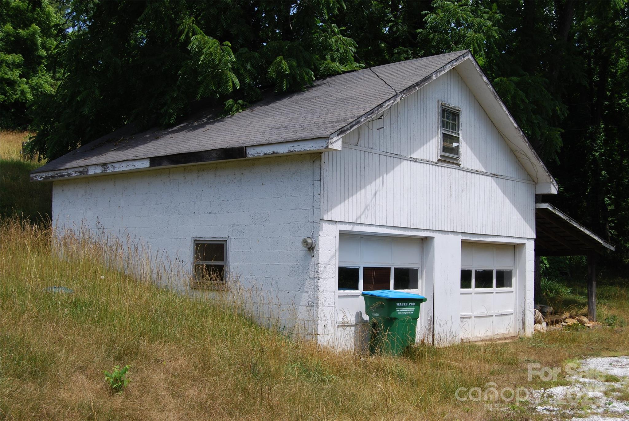 7 Noble Road Fairview, NC 28730 - Photo 12 of 44 a front view of a house with garden
